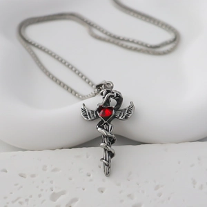 Gothic stainless steel necklace featuring a winged snake sword with a red heart gemstone