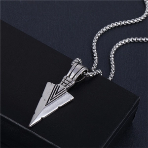 Detailed close-up of retro silver triangle pendant necklace with engraved geometric lines