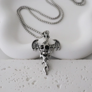 Gothic bat skull necklace with vintage punk demon wings and flame details on a stone base