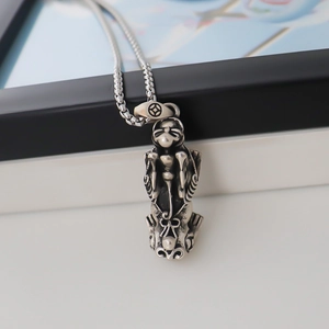 Retro silver Pixiu pendant necklace with intricate carvings and vintage metal chain
