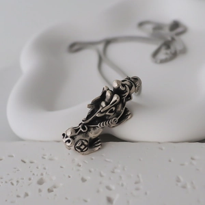 Retro Pixiu pendant necklace in vintage silver finish with detailed mythical beast carvings