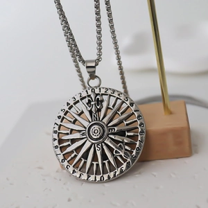 Vintage stainless steel compass pendant necklace with silver textured geometric design