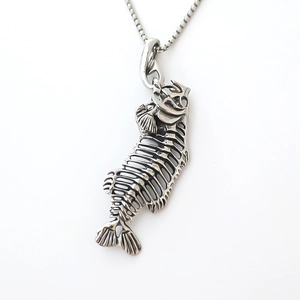 Detailed view of silver fishbone pendant with hollow structure and punk street style box chain