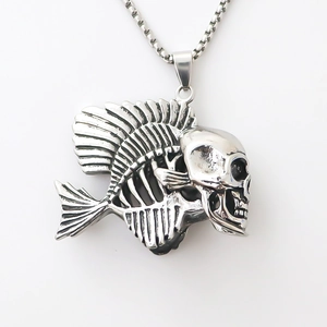 Macro shot of silver fishbone skull pendant with a stainless steel box chain necklace