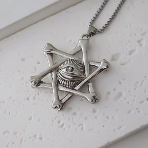 Detailed view of vintage silver hexagram bone pendant with realistic eye relief