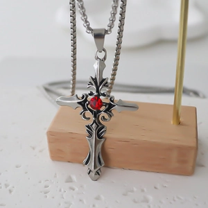 Gothic silver cross necklace with a central red rhinestone on a bold square link chain