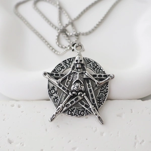 Detailed close-up of gothic skull pentagram necklace with nordic mystic runes