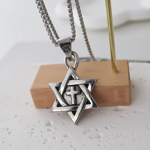 Vintage silver hexagram and cross pendant necklace with classic box chain on wood display