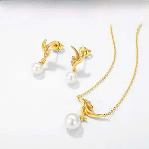 Macro detail of S925 sterling silver stamp on golden pearl earrings and necklace