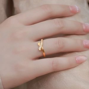 Elegant gold S925 sterling silver ribbon ring with brushed finish and zircon accents