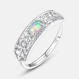 S925 sterling silver opal ring with oval gemstone and intricate hollowed-out carvings