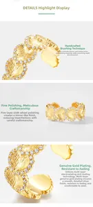 Macro detail of S925 ginkgo leaf ring with brushed gold texture and pavé zircons