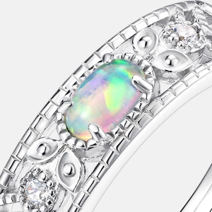 Macro shot of S925 silver ring featuring an oval opal with colorful neon fire and zircon