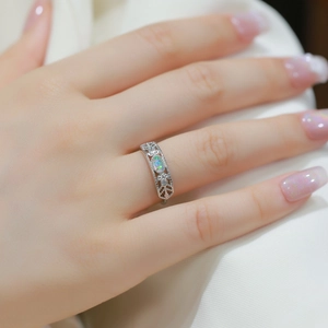 Vintage S925 sterling silver ring with oval opal gemstone and hollow floral patterns