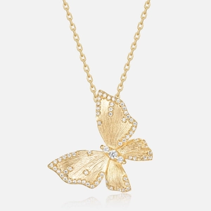 Detail of brushed gold butterfly pendant necklace with sparkling white zircons