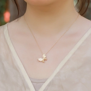Vintage brushed gold butterfly pendant necklace with zircon inlays for women