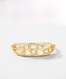Detail of hollowed leaf ring with shell pearls in vintage gold-plated S925 silver