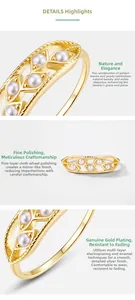 Close-up of gold-plated leaf ring with shell pearls and fine hollow engraving detail