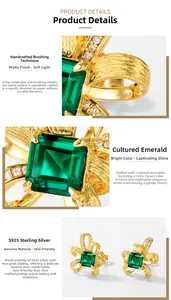 Detail of S925 silver gold-plated bow earrings with lab emerald and brushed texture