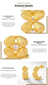 Detail of S925 silver flower hoop earrings with brushed gold finish and white zircon