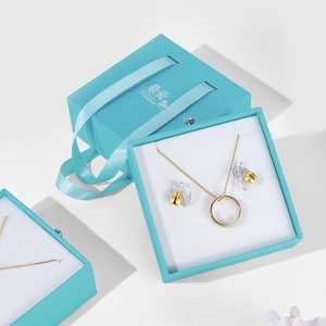 Elegant jewelry gift set with necklace and earrings in premium light blue gift box