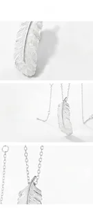 Detail of S925 sterling silver feather pendant showing polished texture and craftsmanship