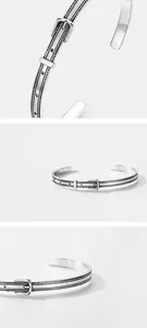 Detail of S925 sterling silver belt buckle bangle showing polished finish and textures
