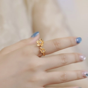 Adjustable golden double flower ring with matte brushed petals and zircon center stones