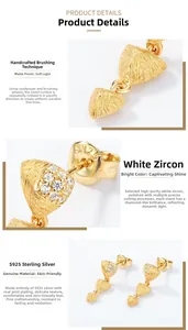 Detailed macro view of gold-plated S925 silver earrings with brushed texture and zircons