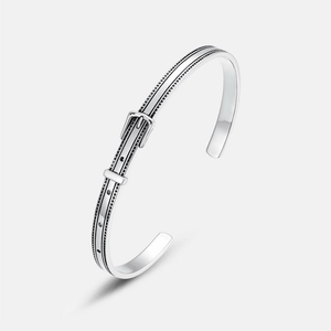 S925 sterling silver belt buckle open bangle with vintage oxidized finish on grey background