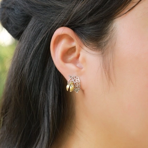 S925 sterling silver ladybug earrings with red agate and gold leaf on a female model