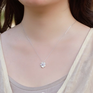 Vintage 925 sterling silver flower necklace with purple zircon on a model