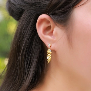 S925 sterling silver wheat tassel earrings with zircons shown on a female model