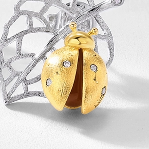 Exquisite S925 sterling silver ladybug stud earrings with gold plating and leaf detail