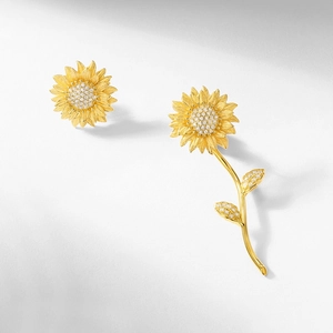 Handcrafted brushed gold sunflower stud earrings featuring sparkling pavé crystals