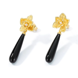 Brushed gold orchid earrings with black onyx teardrops and sparkling rhinestones