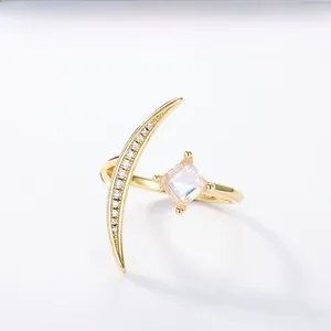 Macro detail of gold S925 silver ring featuring moon and moonstone embellishments