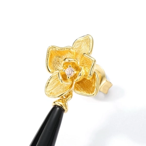 Brushed gold flower earrings with teardrop black onyx pendants and zircon inlay