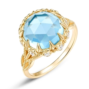 Bague en argent S925 plaqué or avec une topaze bleue naturelle et détails en zircone