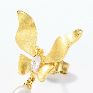 Brushed gold butterfly earrings with marquise zircon and teardrop pearl charms