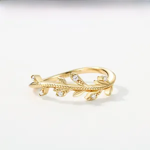 Detailed macro view of S925 sterling silver vine ring with gold finish and zircon stones