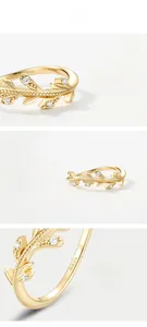 Close-up of S925 sterling silver ring with gold leaf design and white zircon stones
