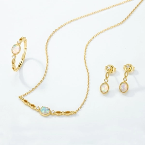Elegant gold-plated S925 silver jewelry set featuring oval opal stones and zircon accents