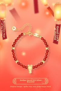 Detailed view of S925 silver horse charm on red agate beaded bracelet with metal stamp