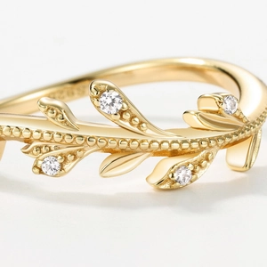Elegant S925 sterling silver olive leaf ring with cubic zirconia stones and gold plating