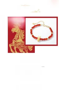 Macro detail of S925 silver bracelet with red agate beads and golden horse charm