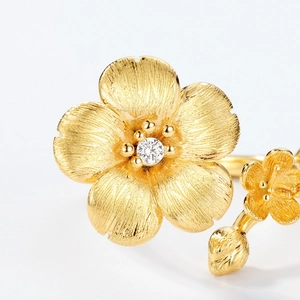 Adjustable S925 silver flower ring with gold brushed petals and sparkling zircon stone