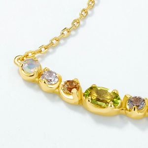 Detail of S925 silver gold-plated necklace featuring multi-color natural gemstones and zircons