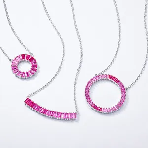 Close-up of S925 silver necklaces with baguette-cut pink gradient corundum pendants