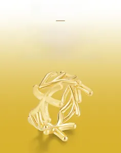 Detail of handcrafted brushed texture on a gold starfish style organic silver ring